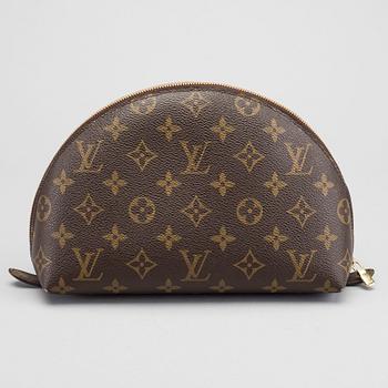 A LOUIS VUITTON COSMETIC POUCH.