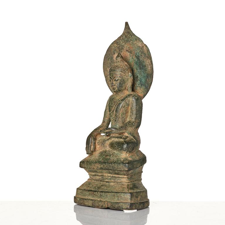 A bronze figure of Buddha with a halo, Burma, 16th century.