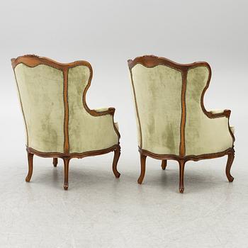 A pair of bergère armchairs, rococo-style, first half of te 20th century.