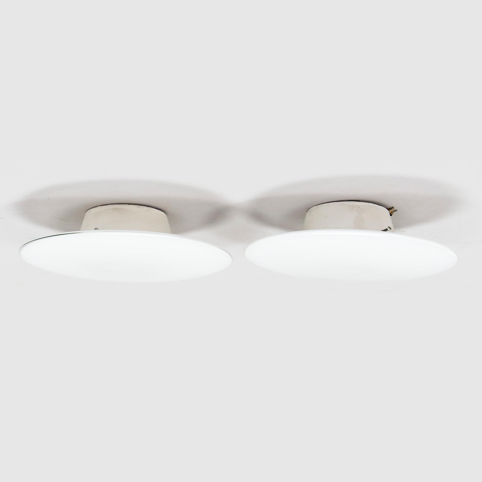 Arne Jacobsen, a pair of 1960's 'AJ-Eklipta' ceiling / wall lamps, for Louis Poulsen/licensed manufacturer Orno, Stockmann.