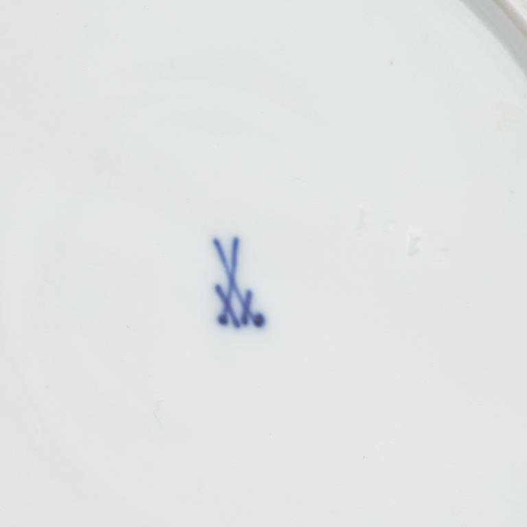 A set of five Meissen porcelain games plates, late 19th to early 20th century.