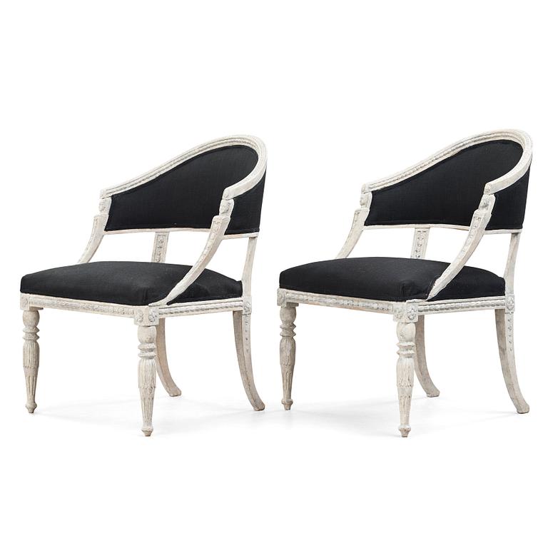 A pair of late Gustavian early 19th century armchairs.