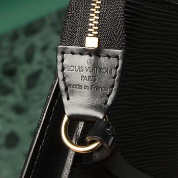 A bag  "Pochette Accessoires" by Louis Vuitton.