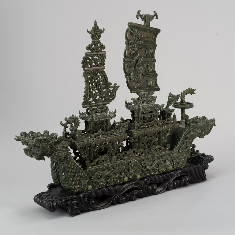 A large Chinese green stone carved sculpture, 20th century.