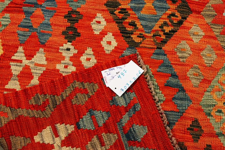 A Kilim carpet, Afghanistan, c. 303 x 206 cm.