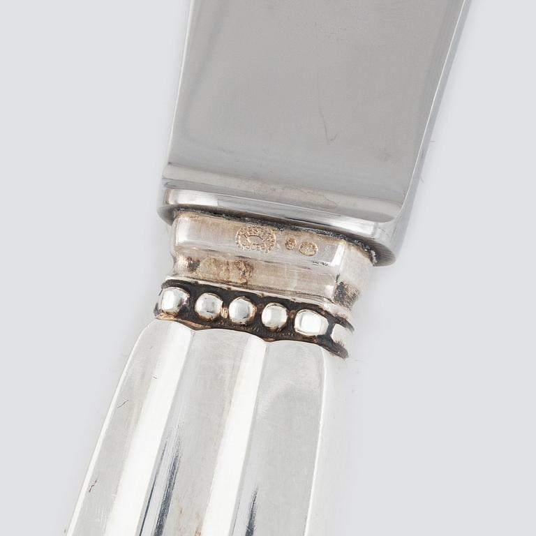 Johan Rohde, a 73-piece sterling silver flat wear set, "Konge/Acorn", Georg Jensen, Denmark.