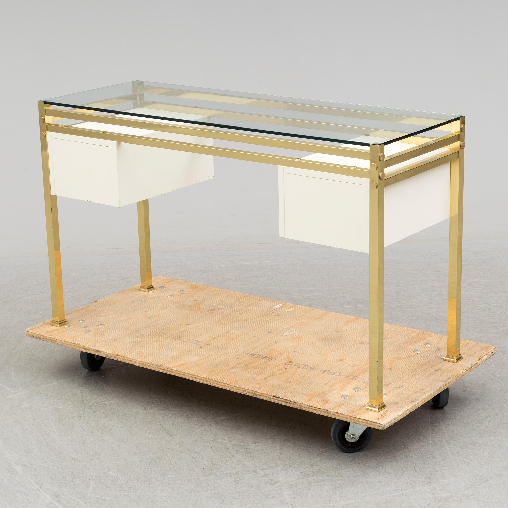 A 1980's dressing table with glasstop.