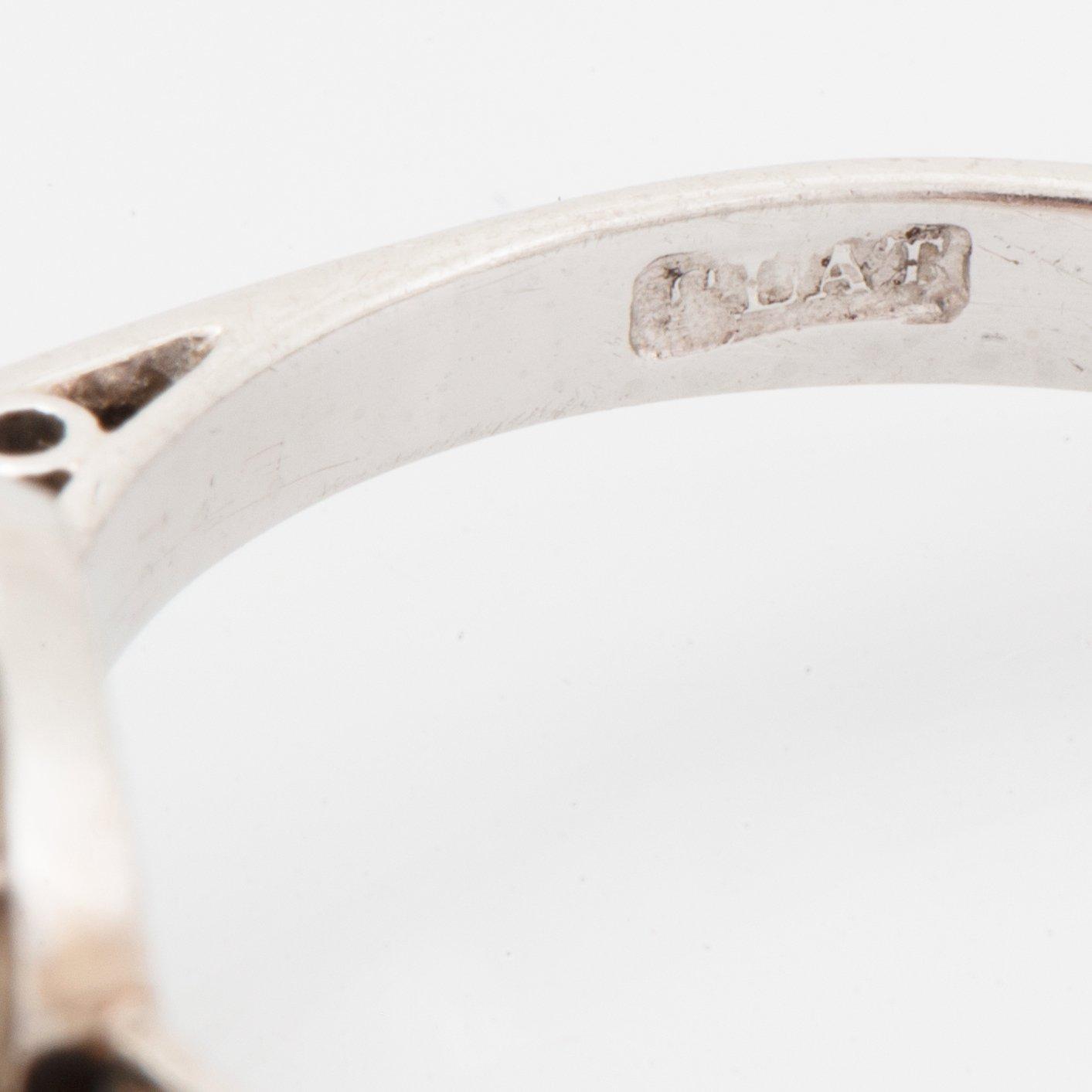 A platinum ring set with an old-cut diamond ca 3.30 cts quality ca J/K vs.