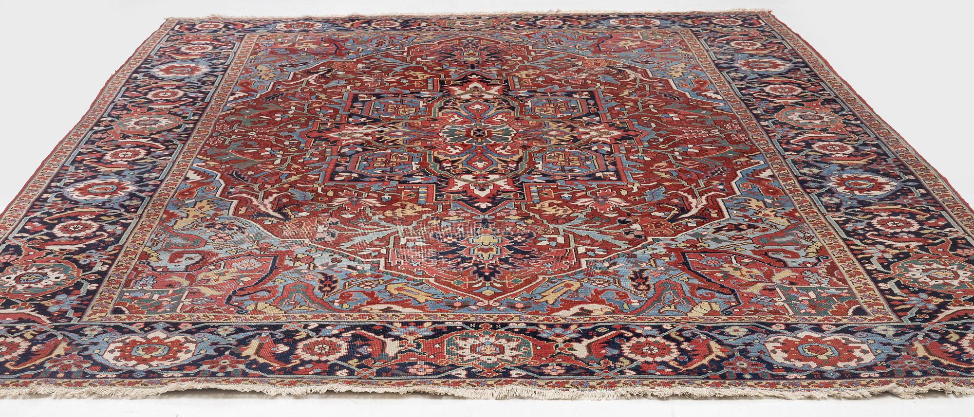 An Antique Heriz carpet, North west persia, c. 380 x 310 cm.