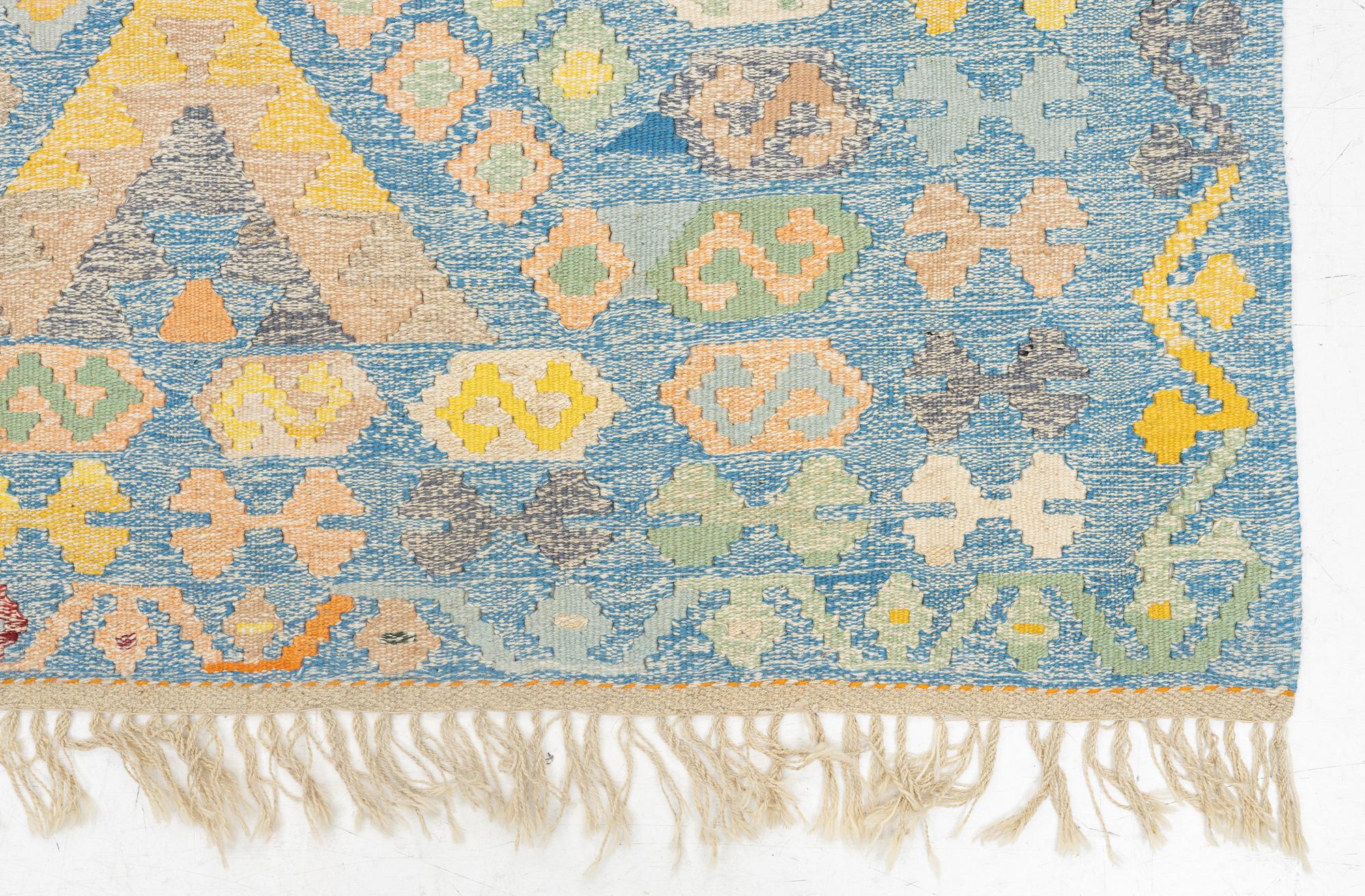 A Kilim rug, c. 255 x 202 cm.