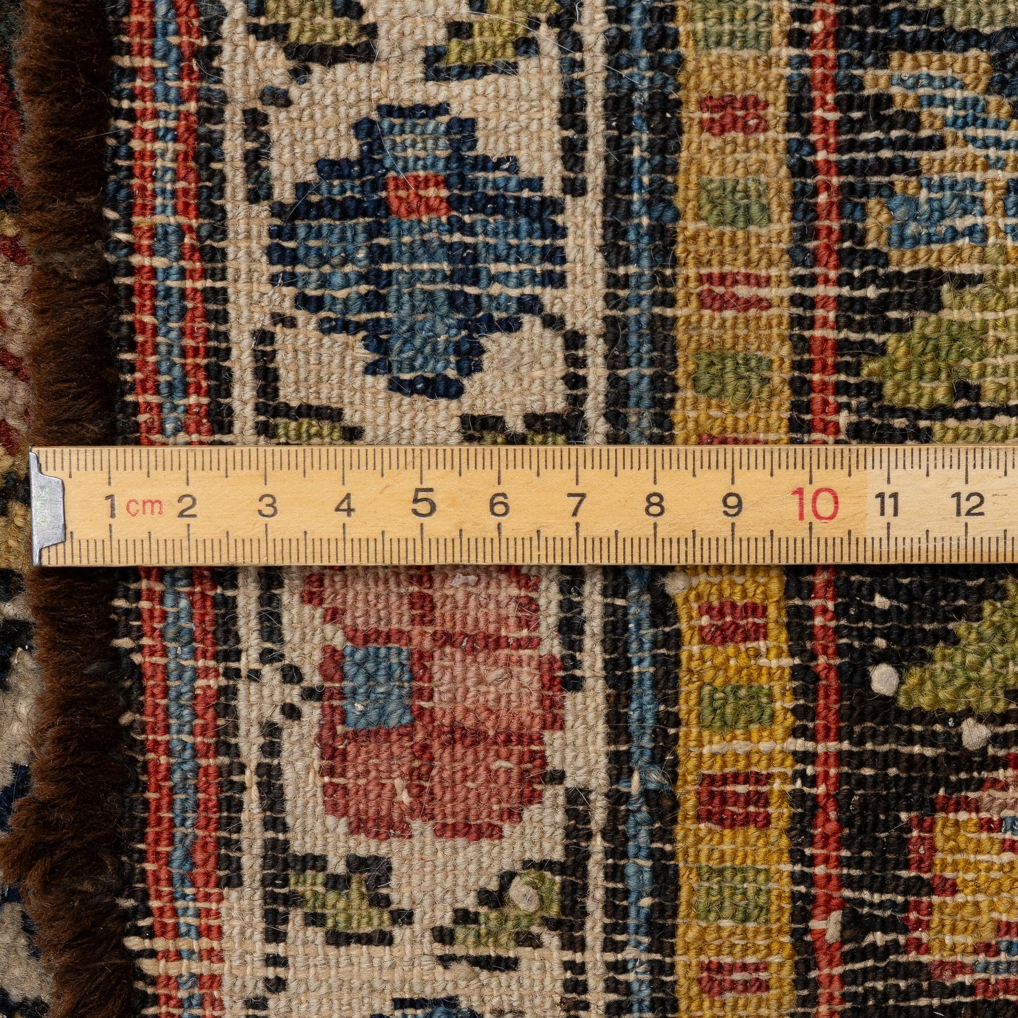 A Bakhtiari carpet, signed, c. 580 x 212 cm.
