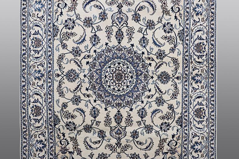 A carpet Nain, part silk, ca 290 x 196 cm.