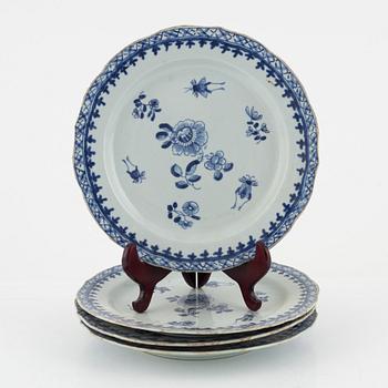 A set of four blue and white dinner plates, Qing dynasty, 18th Century.