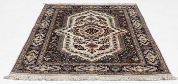 A Tabriz rug, c. 155 x 102 cm.