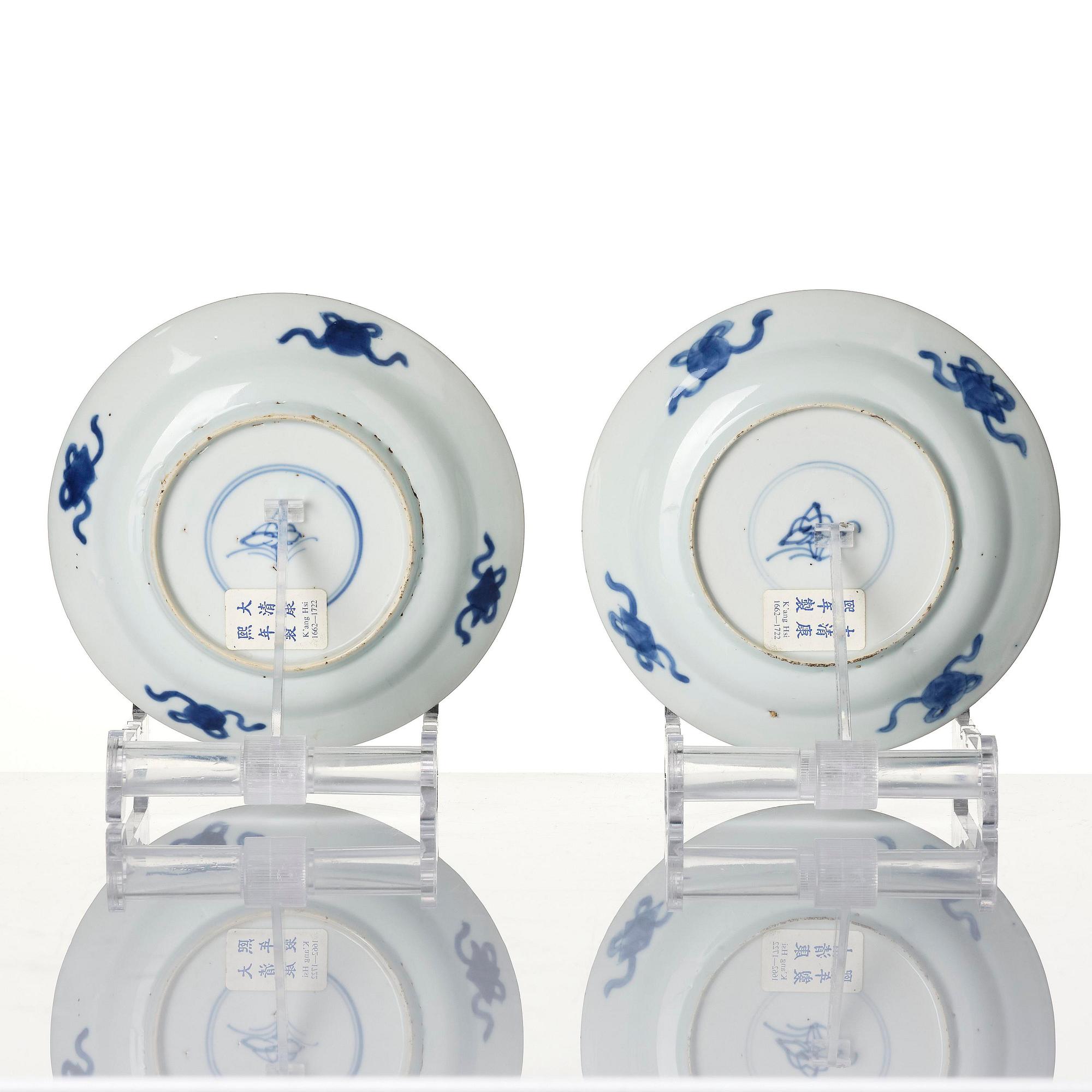 A pair of blue and white 'dragon and fish dishes', Qing dynasty, Kangxi (1662-1722).