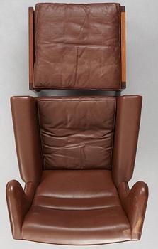 Hans J. Wegner, a pair of "AP-65" easy chairs with stools, AP-stolen, Denmark 1960's.