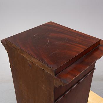 An early 19th Century empire mahogany cabinet.