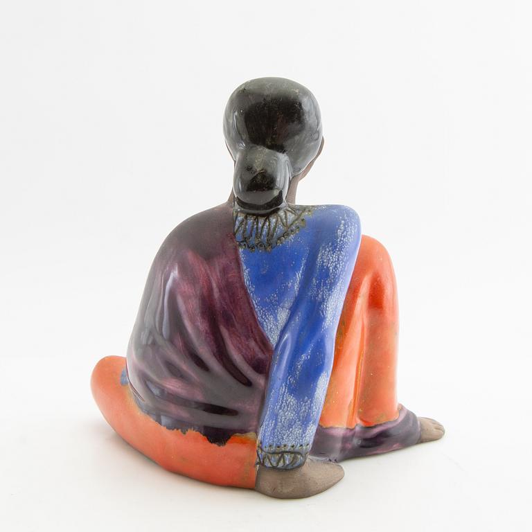 Mari Simmulson, figurine of a seated woman.