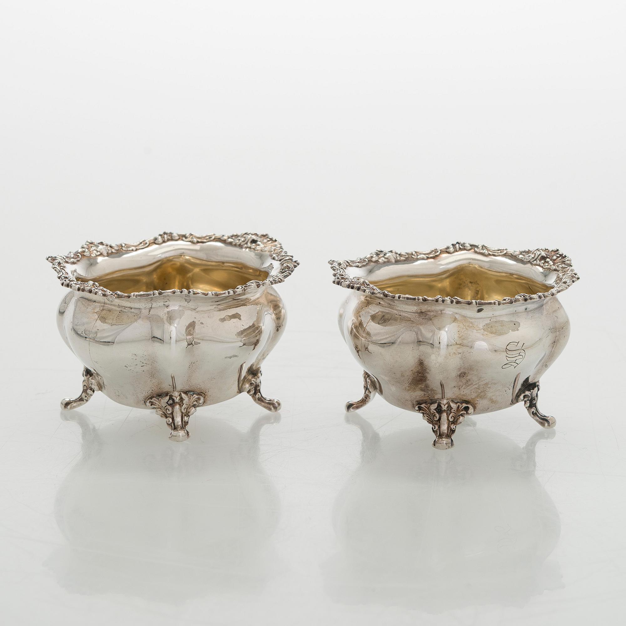 Black Starr & Frost, a pair of sterling silver shakers and sugar bowls, USA around 1900, Gorham pair of sterling spoons.
