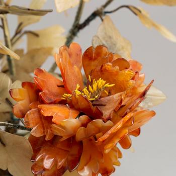 A stone flower pot with a flower made of stones, China, 20th Century.