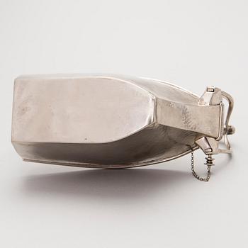 A metal wine bottle stand from WMF, Geislingen, Germany first half of the 20th Century.