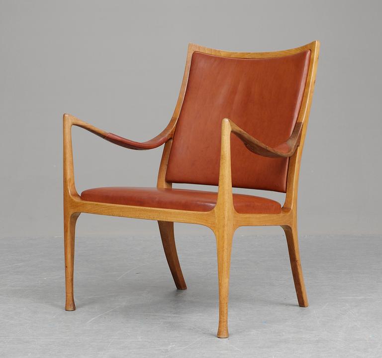 A Hans Asplund walnut and leather easy chair, exclusively made for the beauty parlour at Nordiska Kompaniet, 1955.