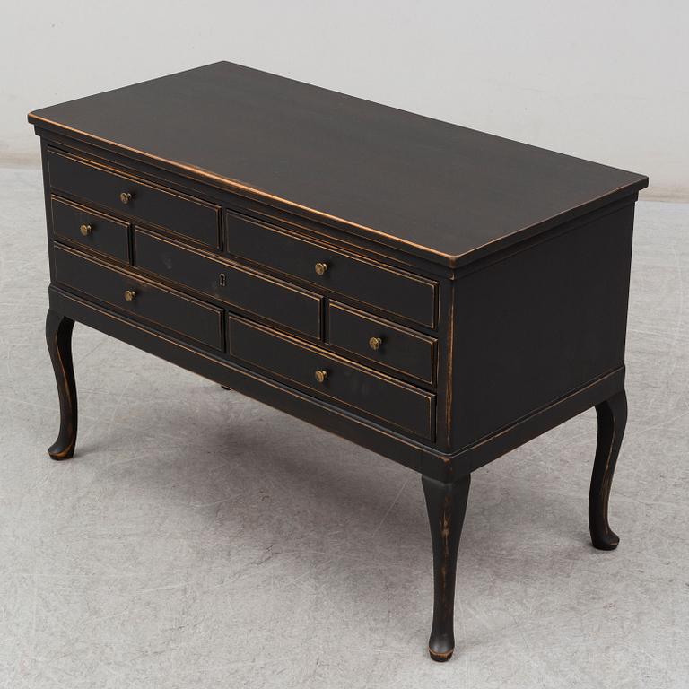 A rococo-style chest of drawers from the first half of the 20th century.