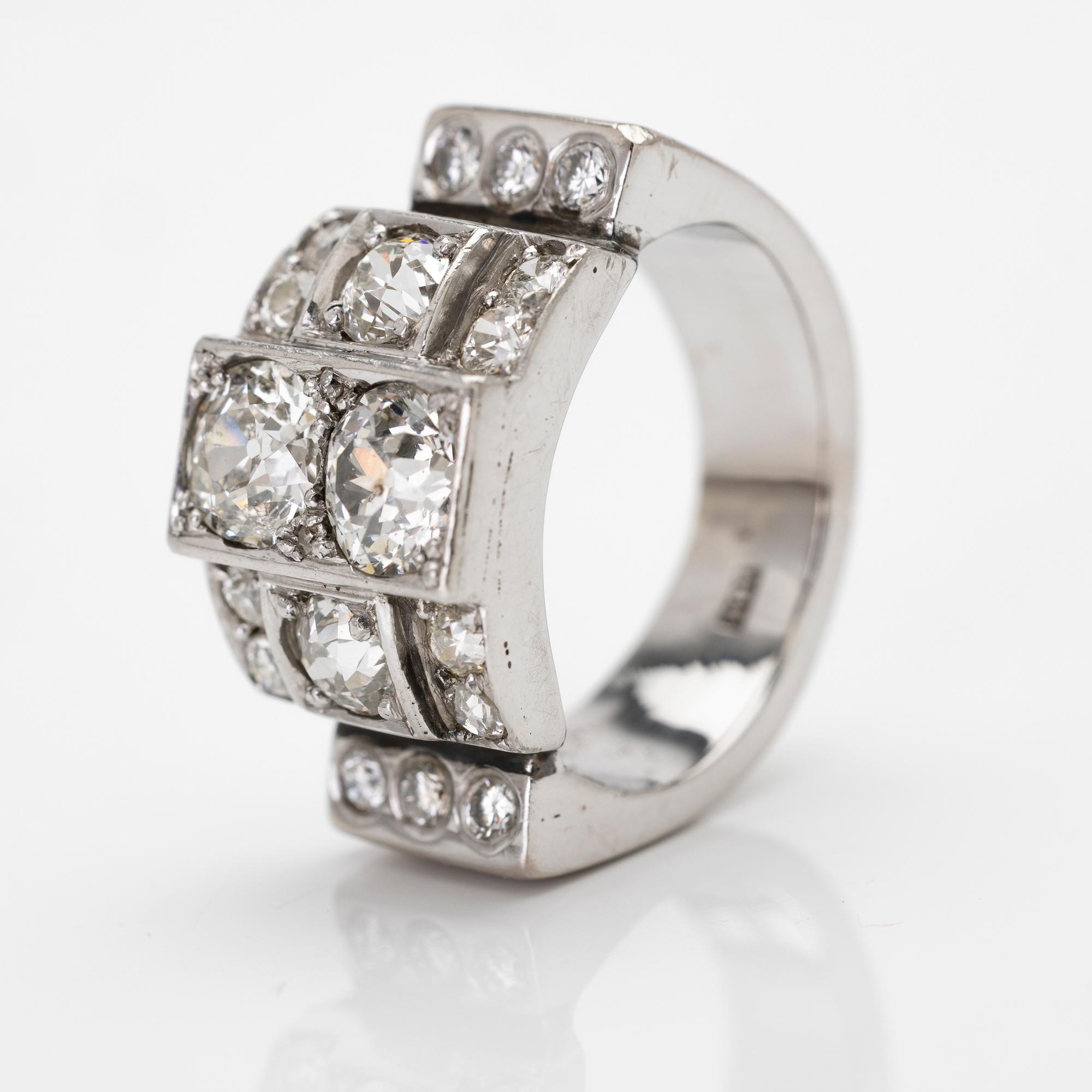 18K white gold ring with diamonds.
