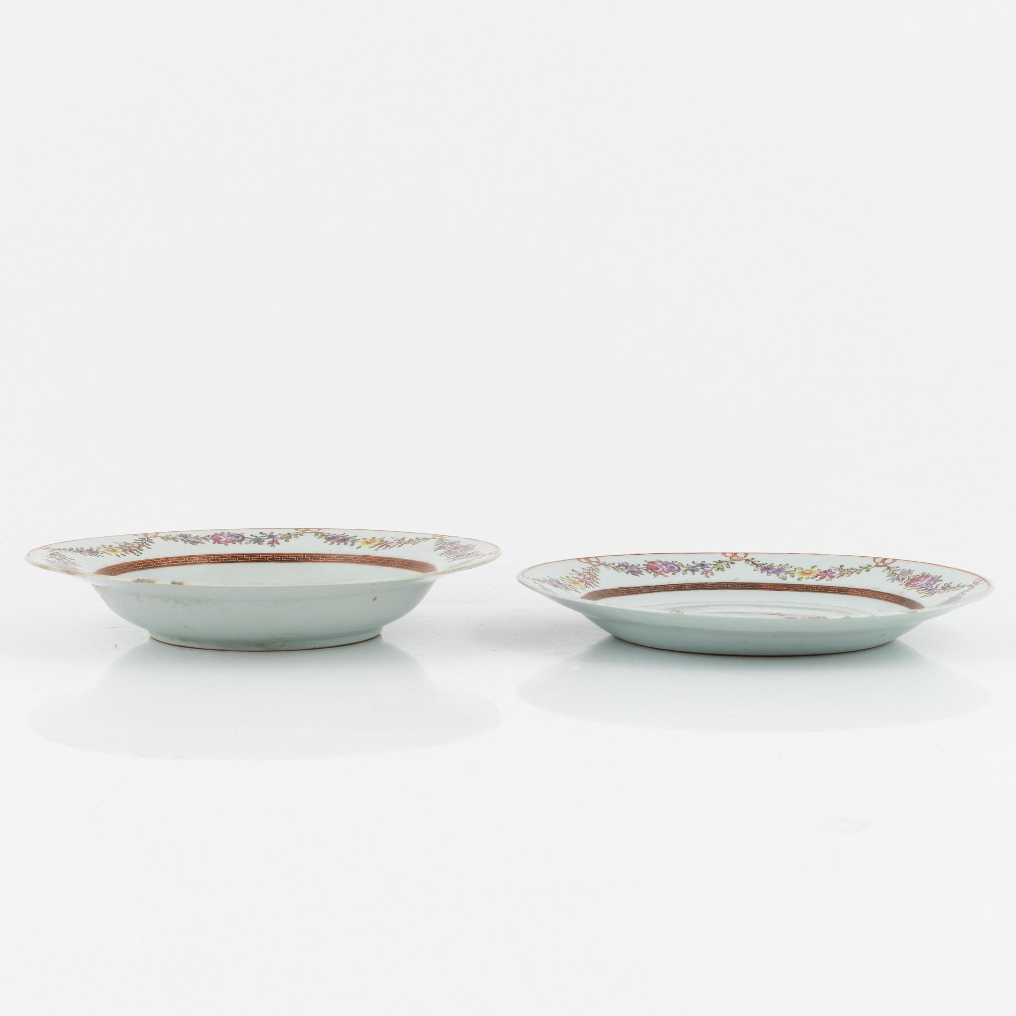Six Famille Rose plates, and a blue and white dessert dish, China, 18th century.