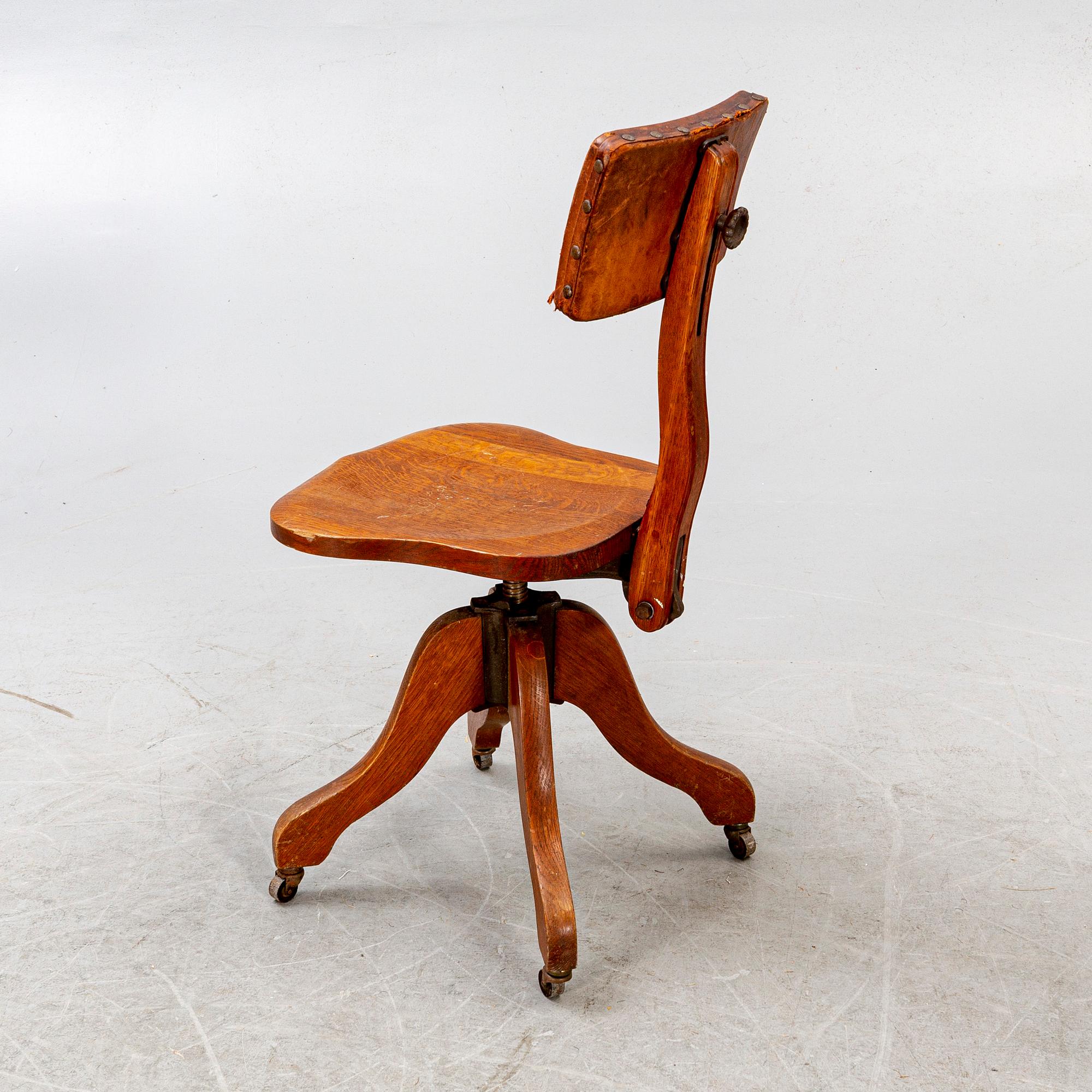 An early 1900s oak office chair.