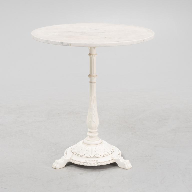 A Byarum garden table later part of the 20th century.