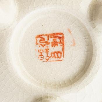 A collection of vases, bowls, and boxes 10 dlr Japan 20th century.