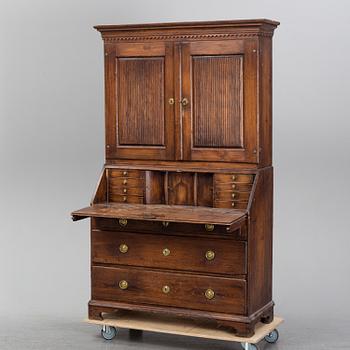 An early 19th Century pine cabinet.