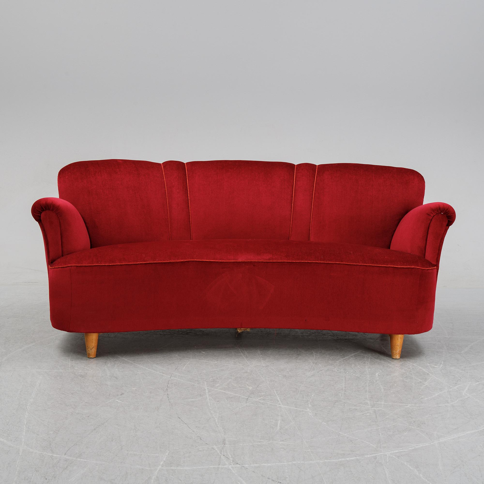 A first half of the 20th Century sofa with velvet upholstery.