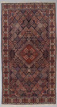 A semi-antique carpet from Joshaghan, around 348 x 190 cm.