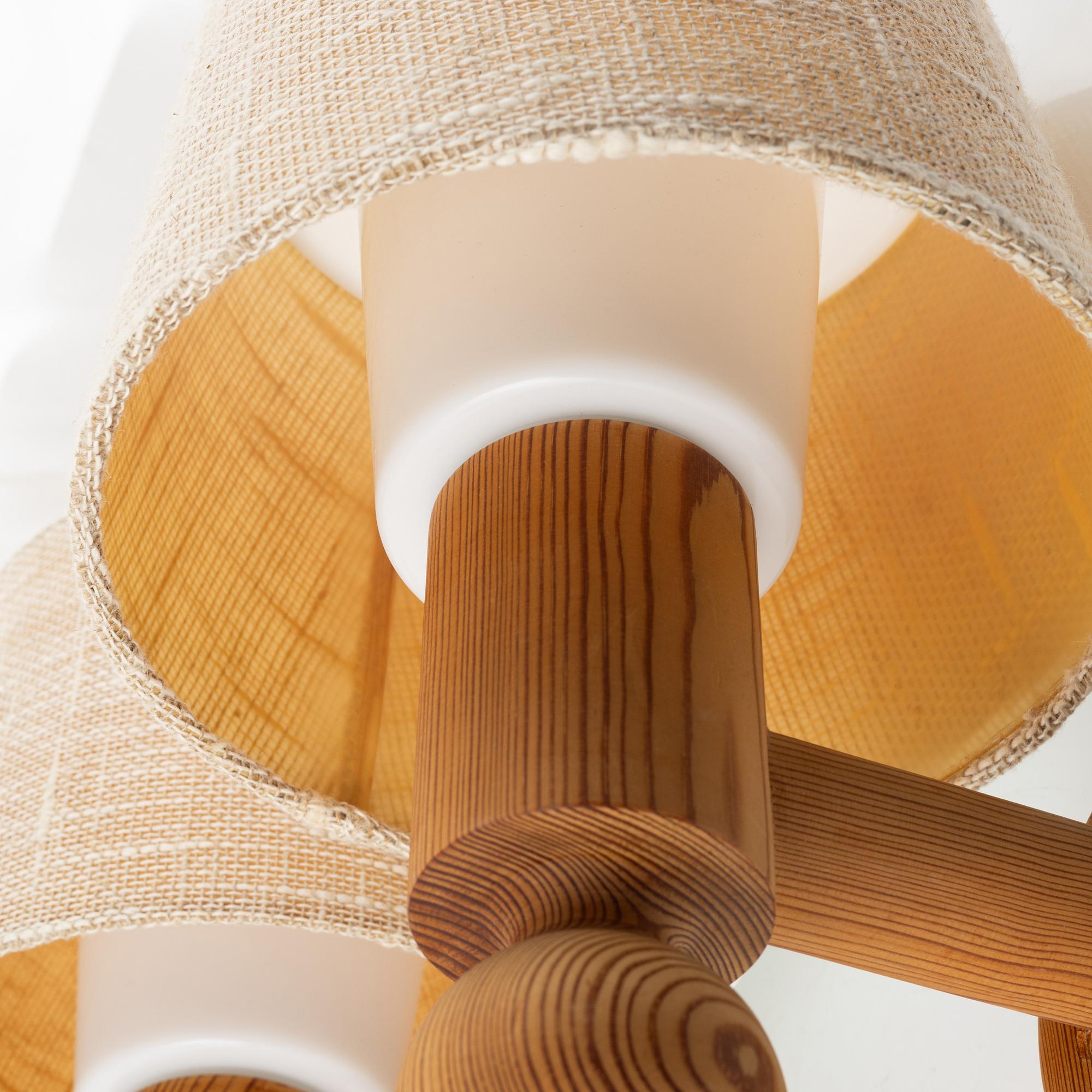 Uno & Östen Kristansson, a pair of pine wall lamps, Luxus, 1970s.