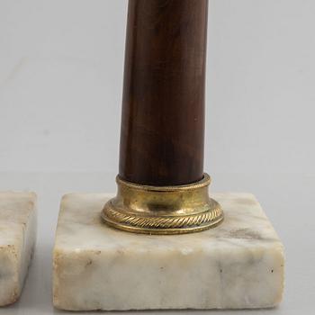 A pair of late Gustavian gilt brass, marble and birch candlesticks, circa 1800.