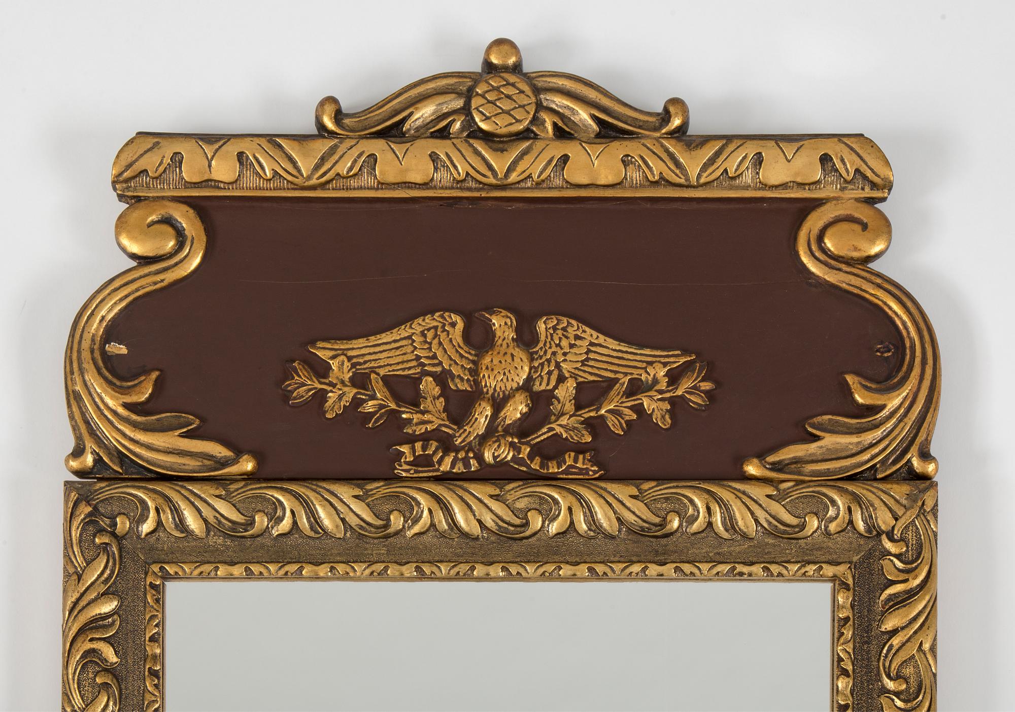 a bronzed mirror and a console table from the second half of the 20th century.