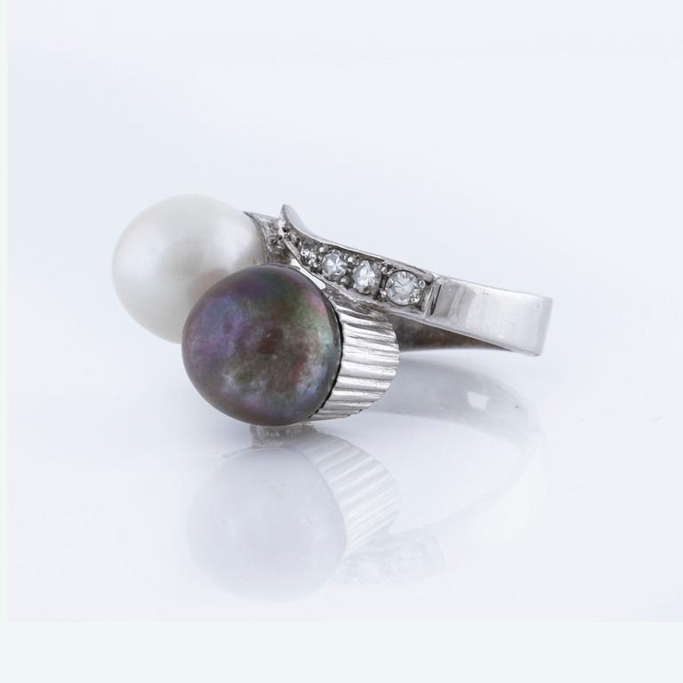 A cultured pearl and single cut diamond ring.