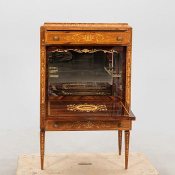 A mid 1900s European bar cabinet.