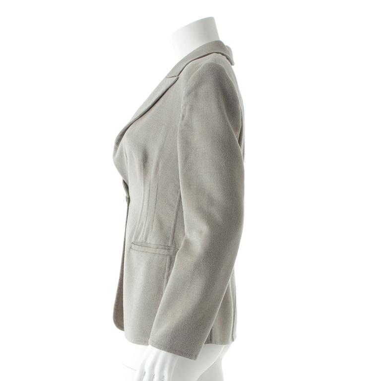 ARMANI, a grey cashmere jacket.