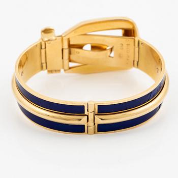 A Gucci bracelet 18K gold with blue enamel.