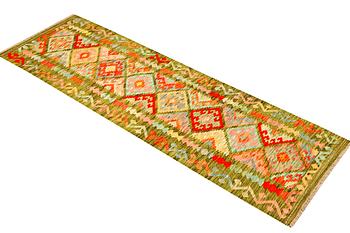 A runner carpet, kilim, c. 241 x 68 cm.