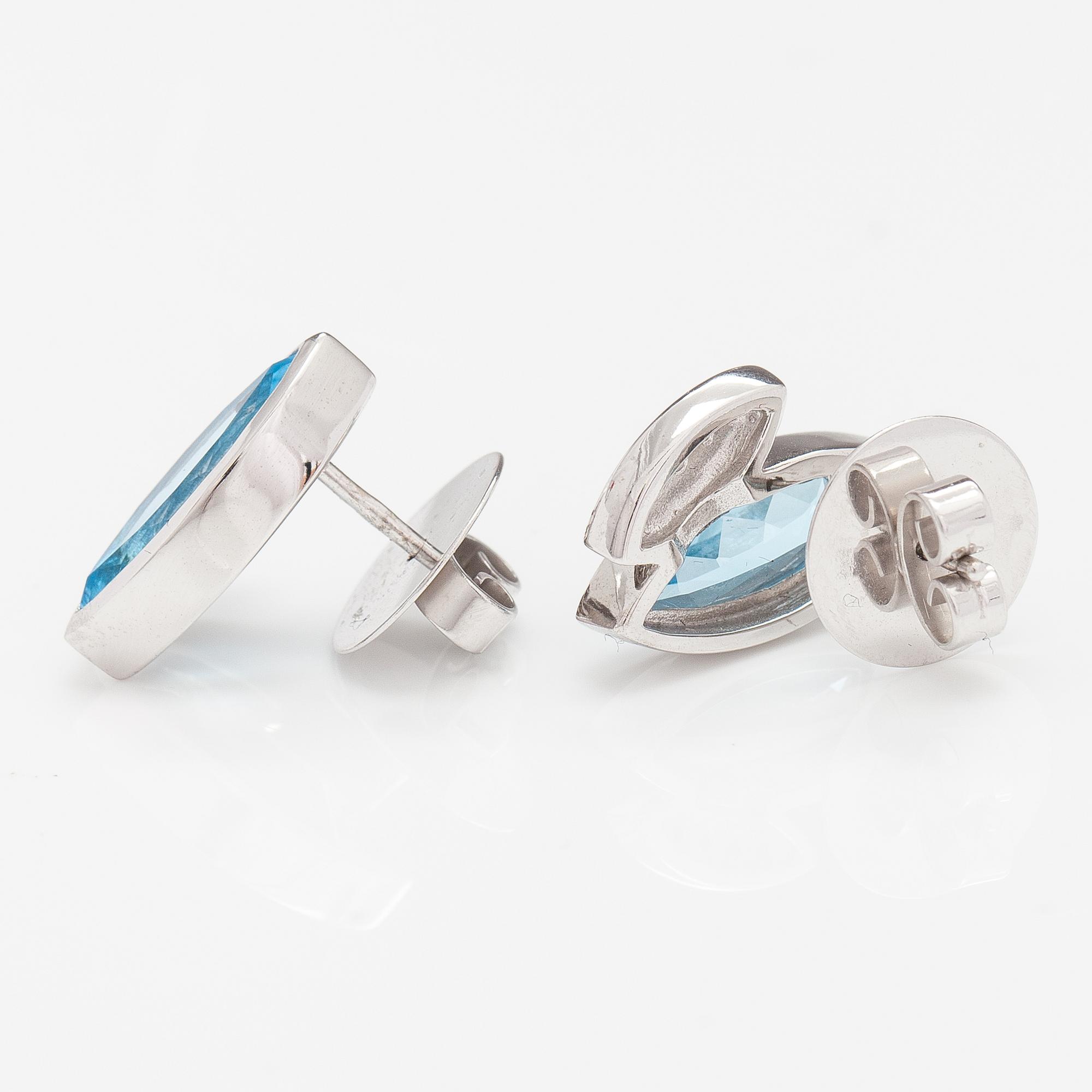 A pair of 14K white gold earrings with topazes and diamonds ca. 0.10 ct in total.