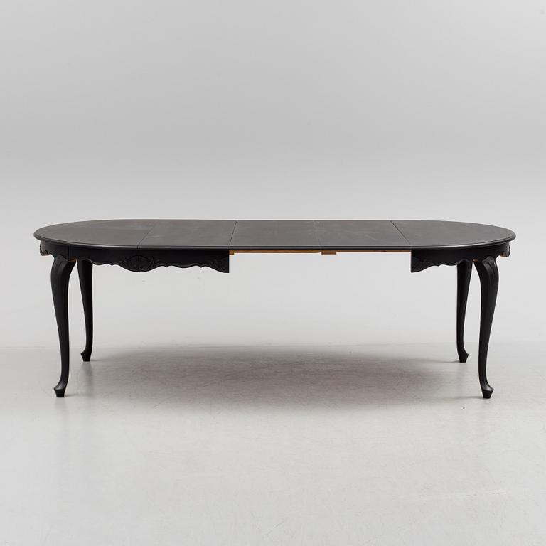 A mid 20th century rococo style dining table.