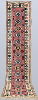 A semi-antique Kars runner, approx. 431 x 95 cm.