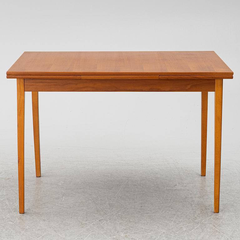 A mid20th century dining table.