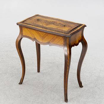 A Louis XV style table, circa 1900.
