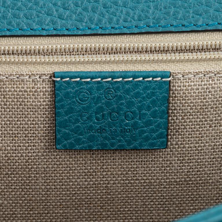 Gucci, a pebbled leather 'Interlocking G' bag.