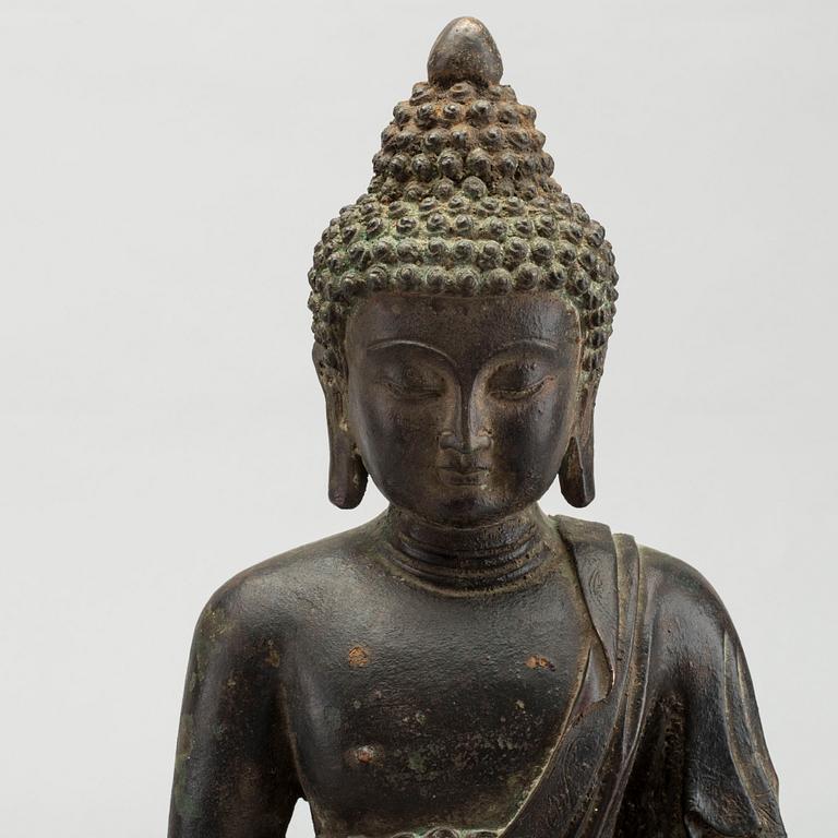 A bronze seated figure of Shakayamuni buddha, Mingtype.